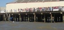 Jono waves to the crowds, back at Clacton pier